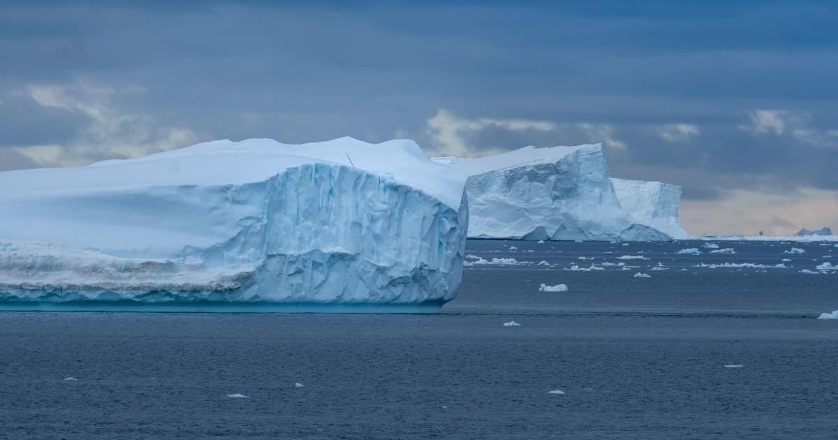 Navigating among enormous icebergs, including the world's largest recorded B-15, which calved from the Ross Ice Shelf of Antarctica. (Representative Cover Image Source: Getty Images | Photo by Leamus )