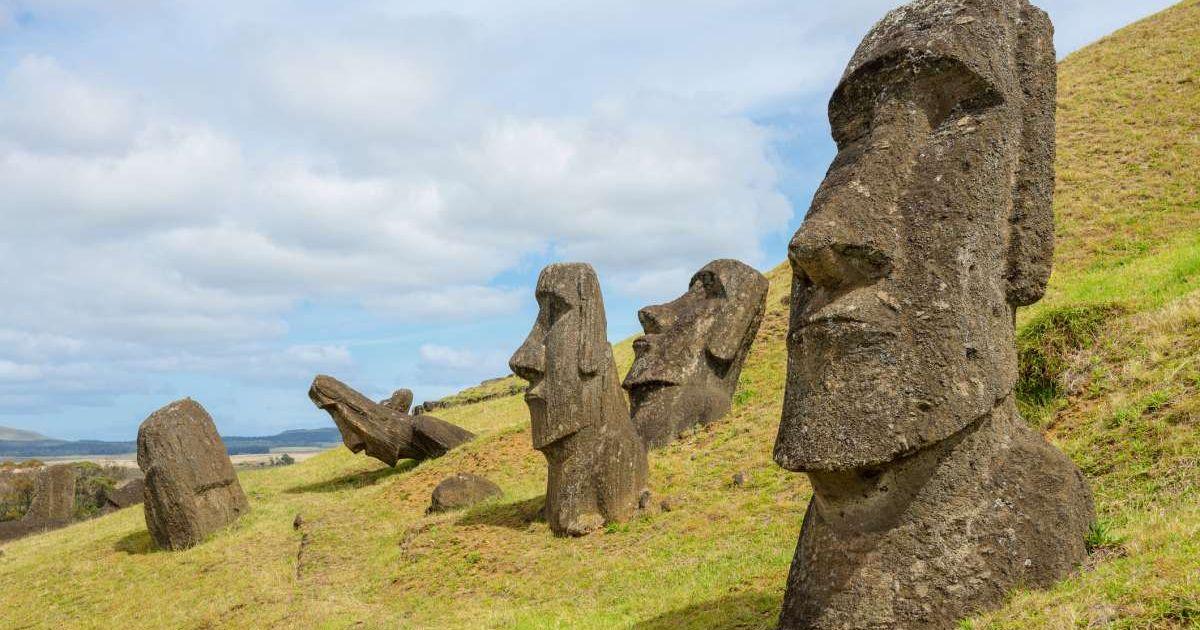Moai stone statues in a valley in Rapa Nui island (Representative Cover Image Source: Getty Images | Volanthevist)