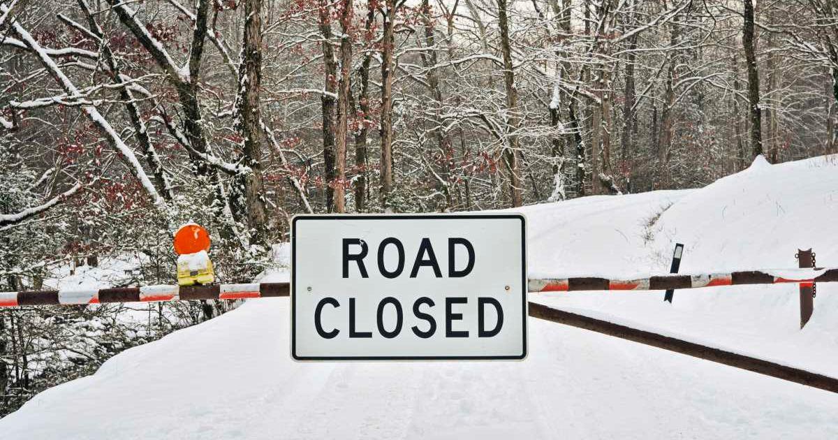 A gate with a road closed sign during winter snow (Representative Cover Image Source: Getty Images | WBritten)