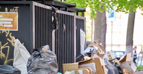 A Dumpster With Trash