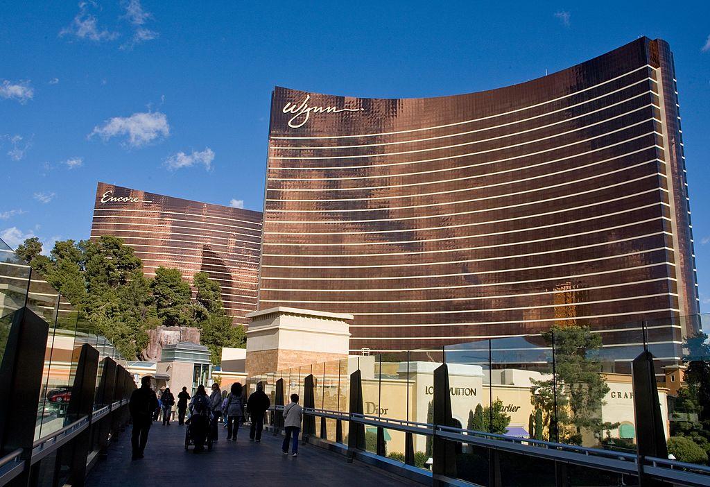 The Wynn Las Vegas appears in front of tourists during the day in Las Vegas.