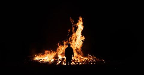Silhouette of person in front of fire (Representative Cover Image Source: Getty Images | Shay Murphy Photography)