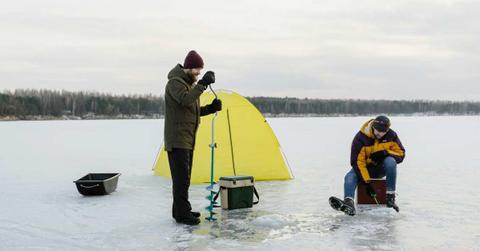 Two researchers drilling a hole on an icy plain. (Representative Cover Image Source: Pexels | Tima Miroshnichenko)