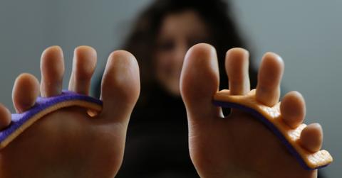 Closeup of woman's feet with toe separators