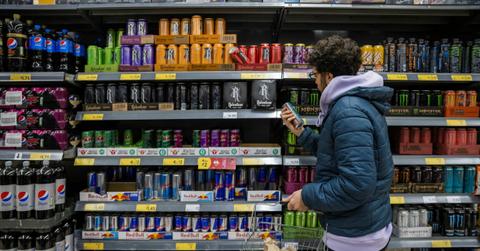 Man shopping for energy drinks at the grocery store