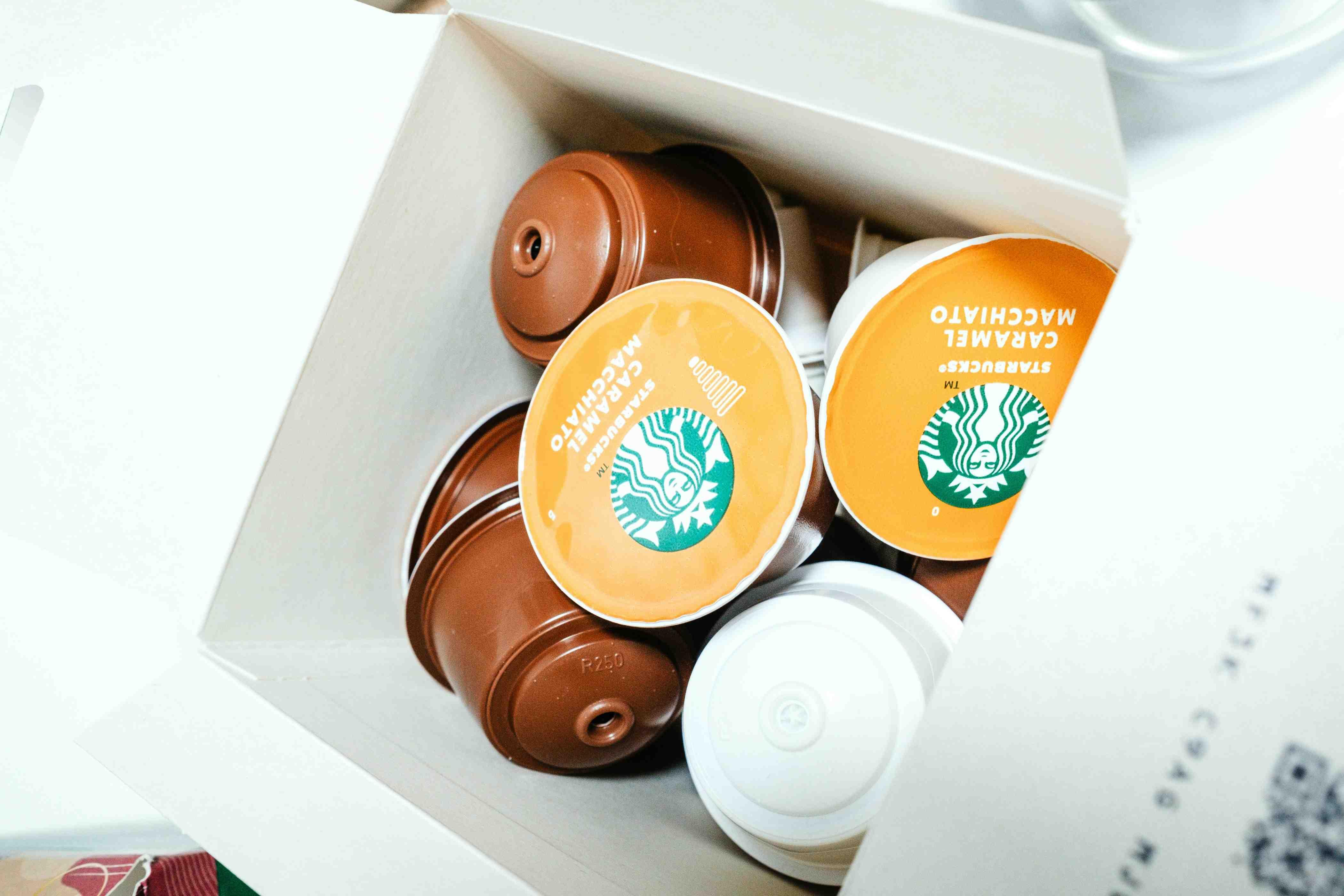 Starbucks Caramel Macchiato single-use plastic pods are pictured in a white box.