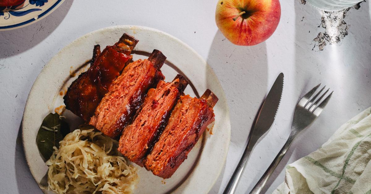 Photo of plant-based meat company Juicy Marbles's Baby Ribs on a while plate on a set table