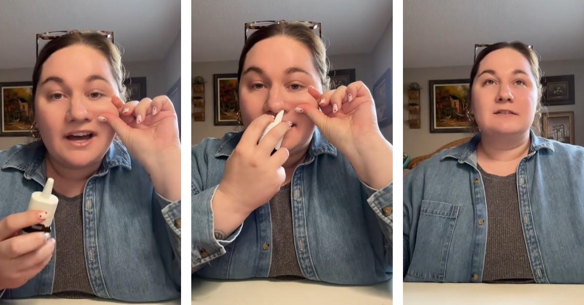 A woman pinches her cheek to open her sinuses before using Flonase nasal spray