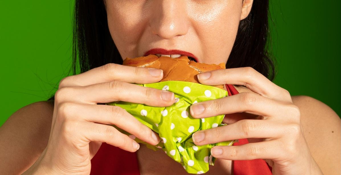 woman eating hamburger