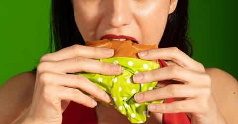 woman eating hamburger