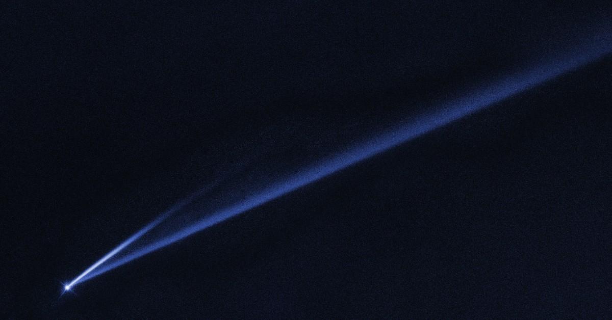 An asteroid streaks through the night sky