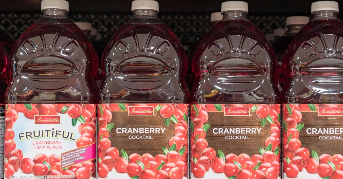 Cranberry juice bottles on a store shelf. 