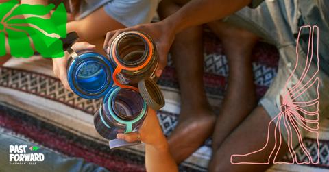 Three People Cheers-ing Nalgenes On a Blanket