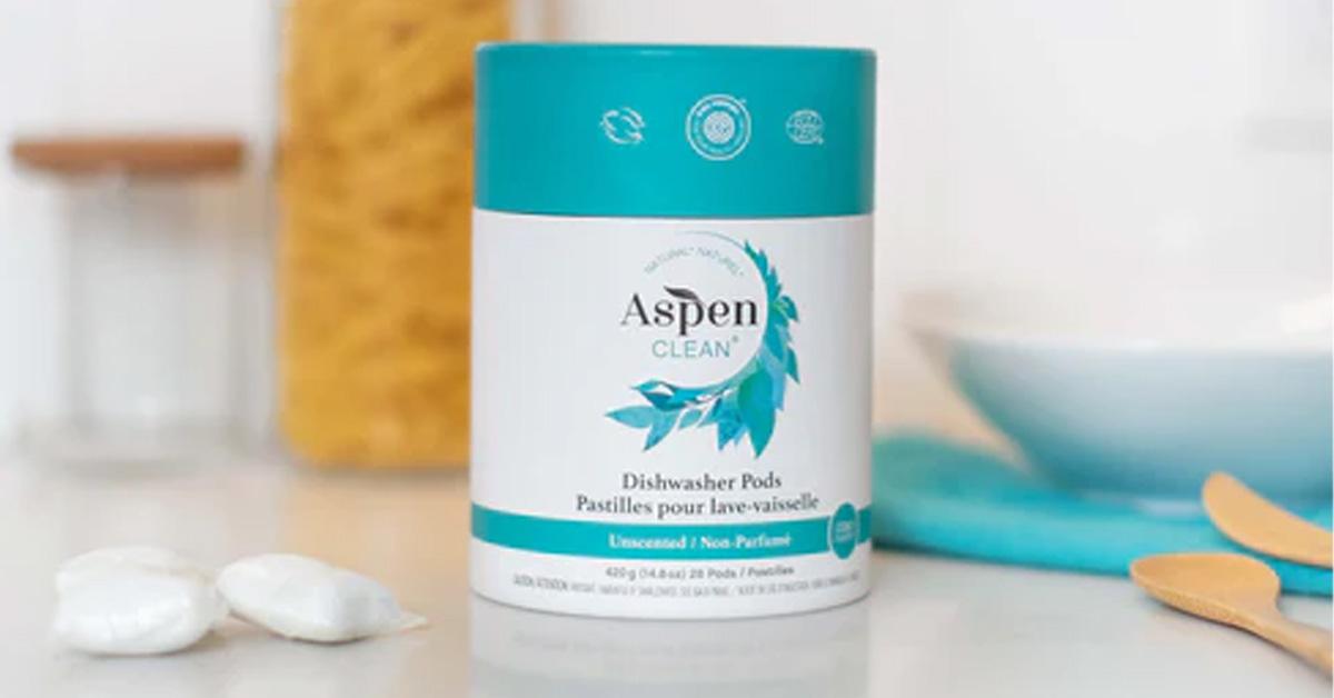 AspenClean Dishwasher Pods on a kitchen counter with bowls, jars and wooden spoons.