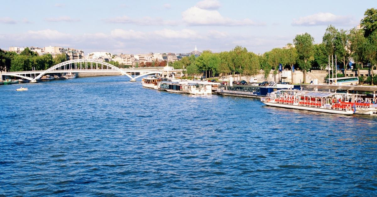 The Seine river with a boat and bridge. 