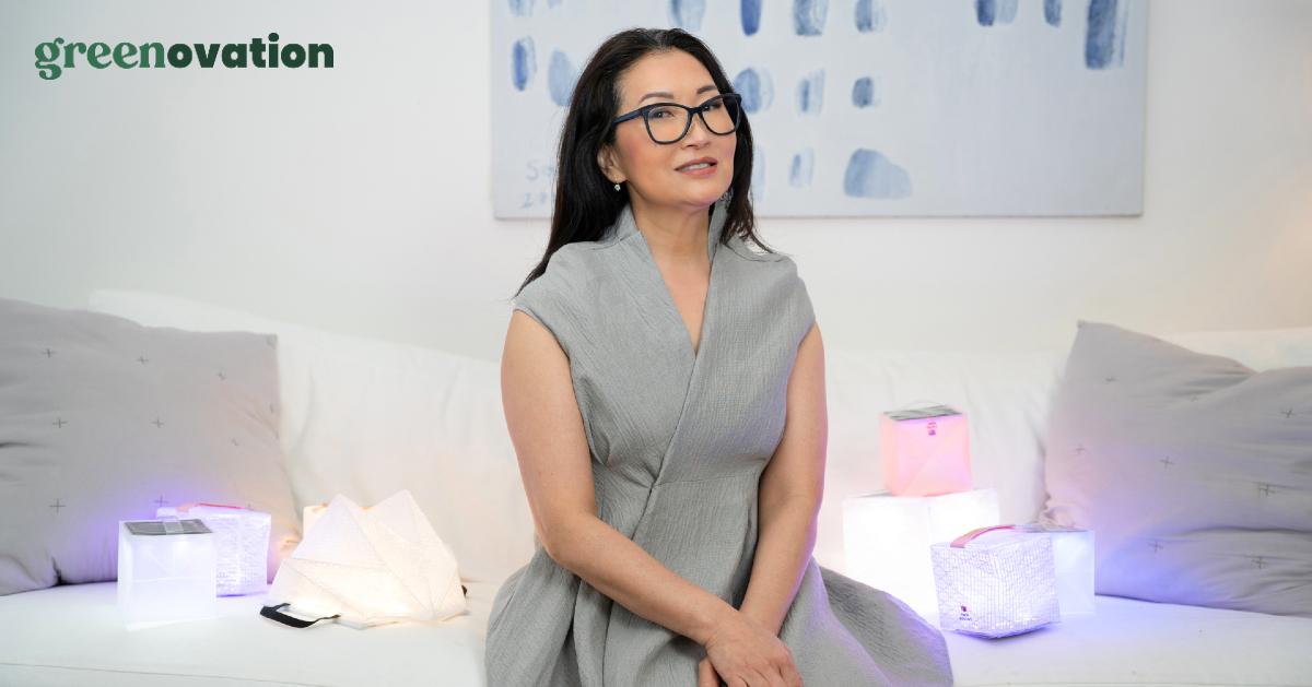 Photo of Solight Design CEO and founder Alice Chun sitting alongside her solar lanterns with the Green Matters Greenovation logo layered over it