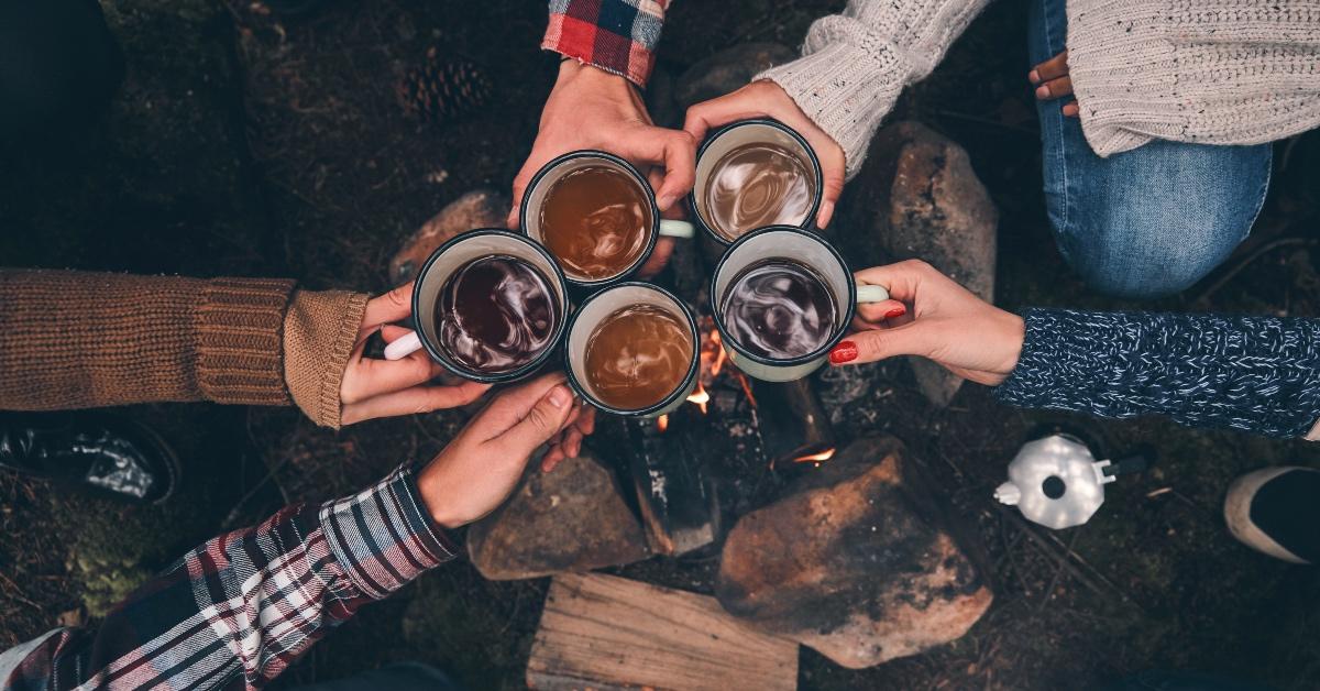 Group of hikers celebrating their hike with trailside coffee.