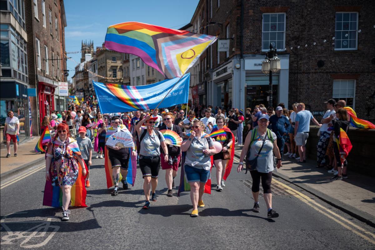 People marching during a Pride March in England.