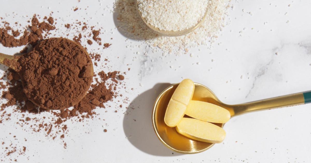 Brown and white powdered supplements and yellow pill supplements. 