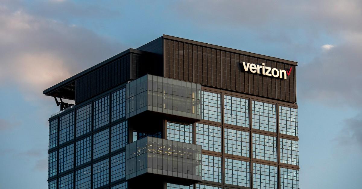 The Verizon logo appears on the top of a building
