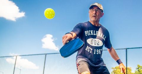 A man playing pickleball.