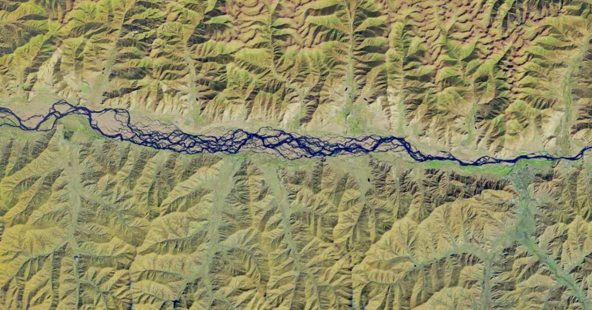 A satellite view of the braided river. (Cover Image Source: NASA | Earth Observatory)