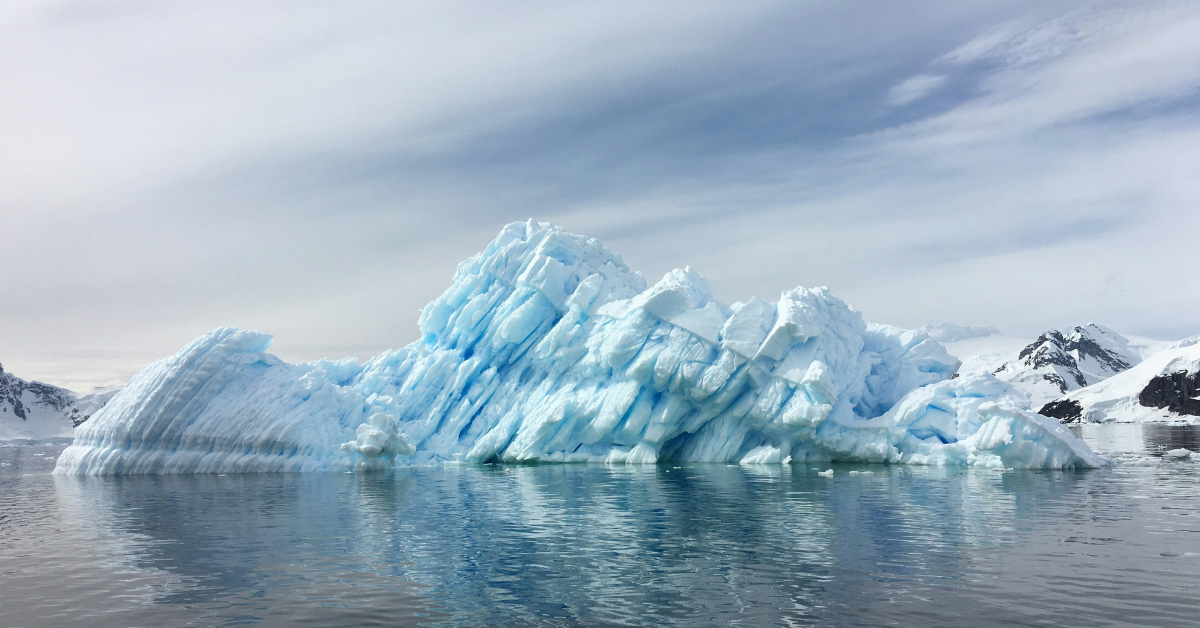 A small glacier floats in the water