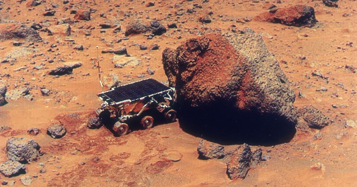 The surface of Mars red dust and rocks. 