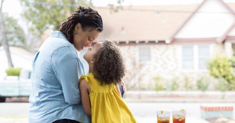 Mother and daughter sitting on the deck, enjoying sweet tea