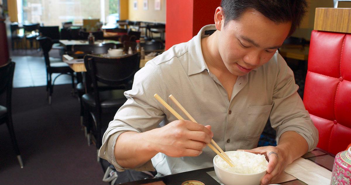 Man eating rice