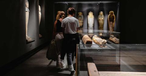 Two people standing in a museum with mummies (Cover Image Source: Shvets Anna|Pexels)
