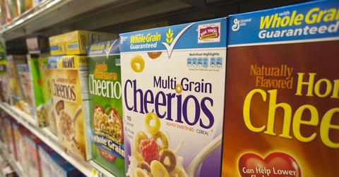 A line of Cheerios-brand cereals on the shelf at the store.