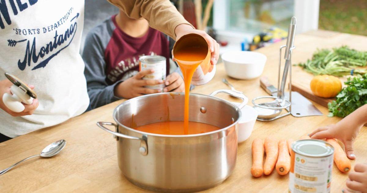 Person pouring a can of soup into a pan (Representative Cover Image Source: Getty Images | Peter Muller)