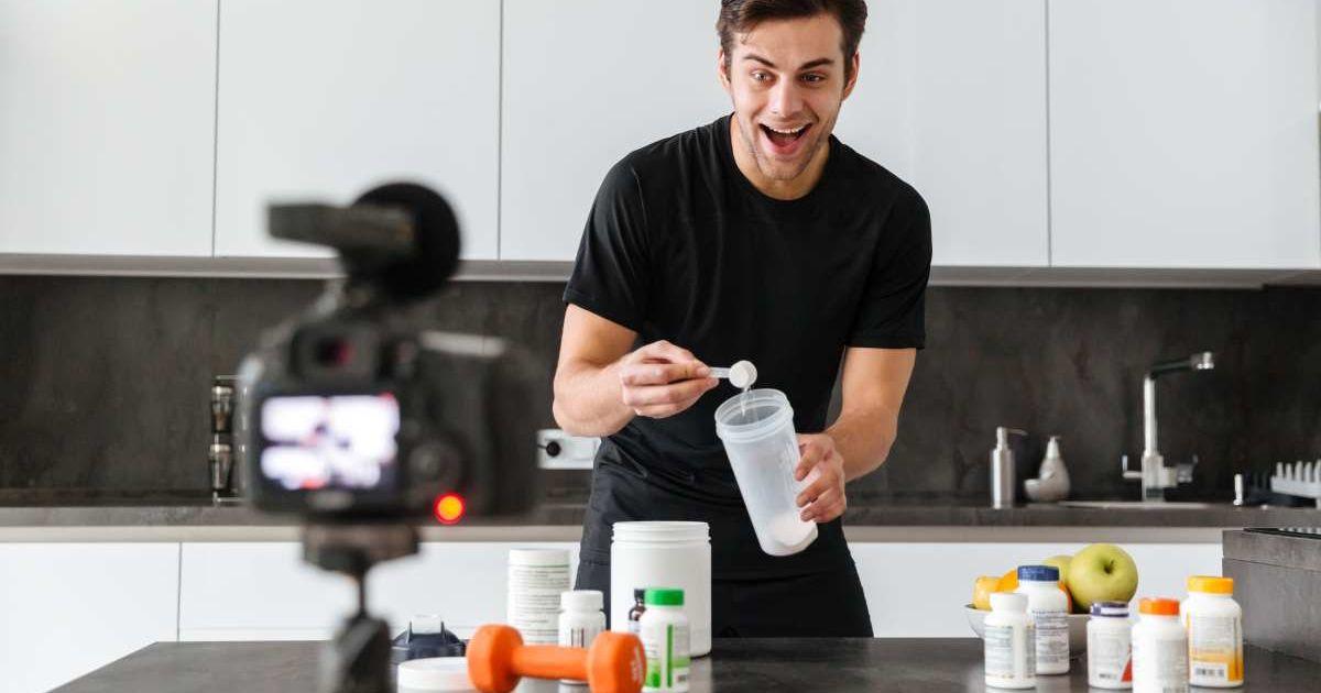 Man records himself mixing a scoop of protein powder in a shake tumbler (Representative Cover Image Source: Freepik)