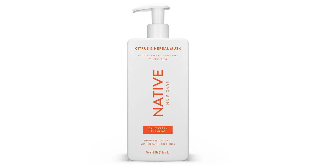 White and orange bottle of Native shampoo