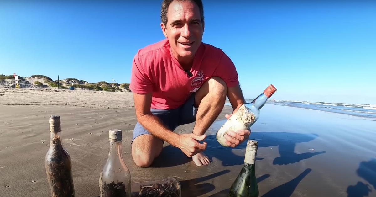 Jace Tunnell with witch bottles found on the Gulf of Mexico. 