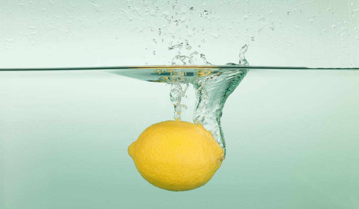 Lemon falling into water