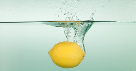 Lemon falling into water