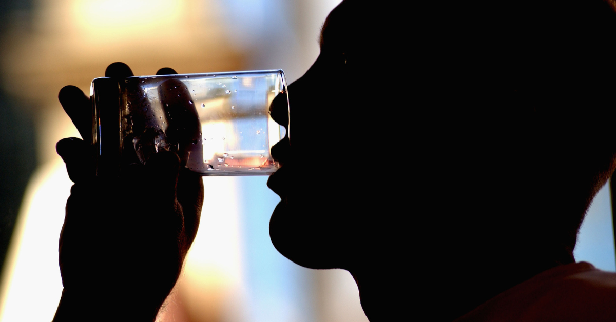 Man drinking a glass of water