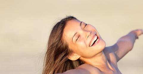 Brunette woman smiling in the sun