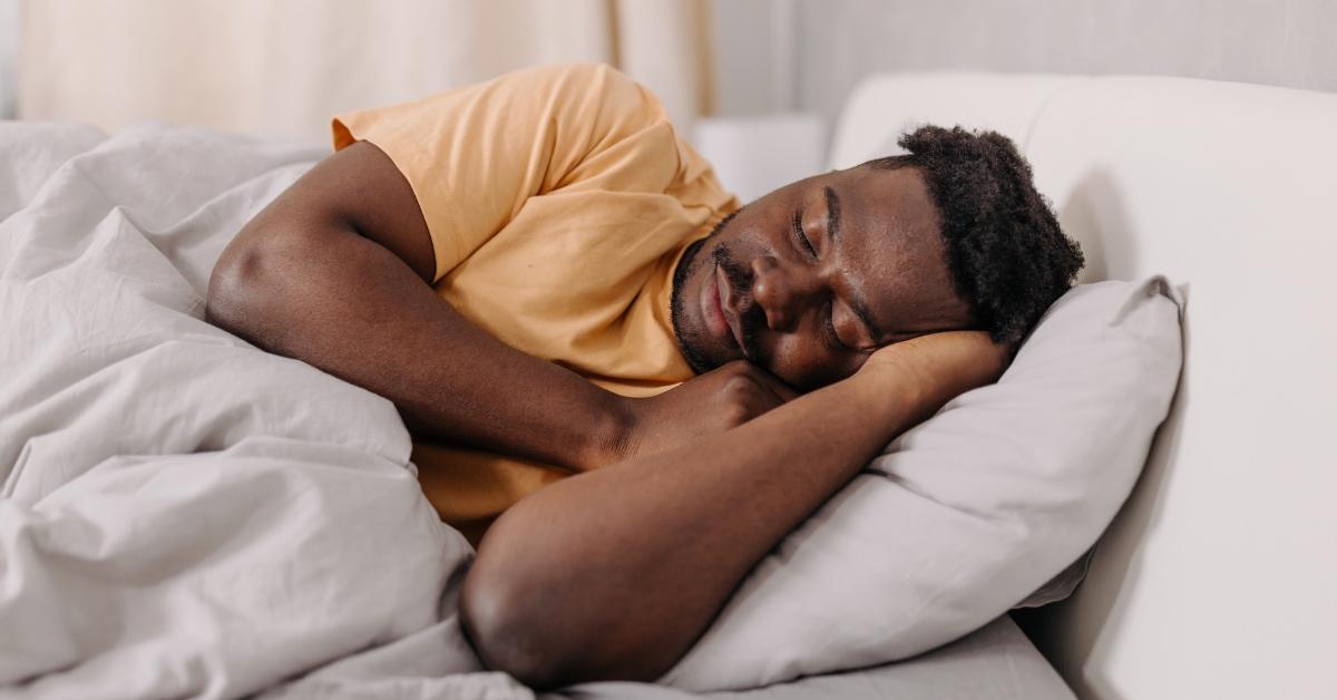 Man sleeping with his arms folded