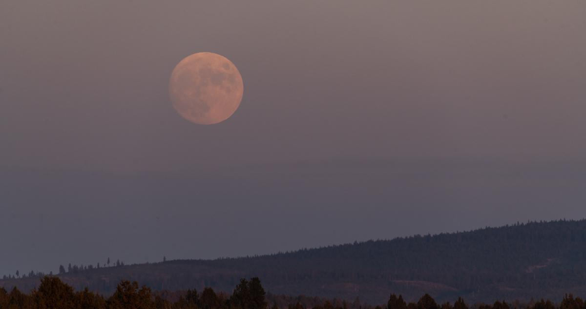 Moon in haze during wildfire.