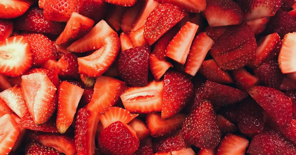 A closeup of sliced and cleaned strawberries
