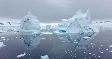 Iceberg reflections in Antarctica. (Representative Cover Image Source: Getty Images | Andrew Peacock)