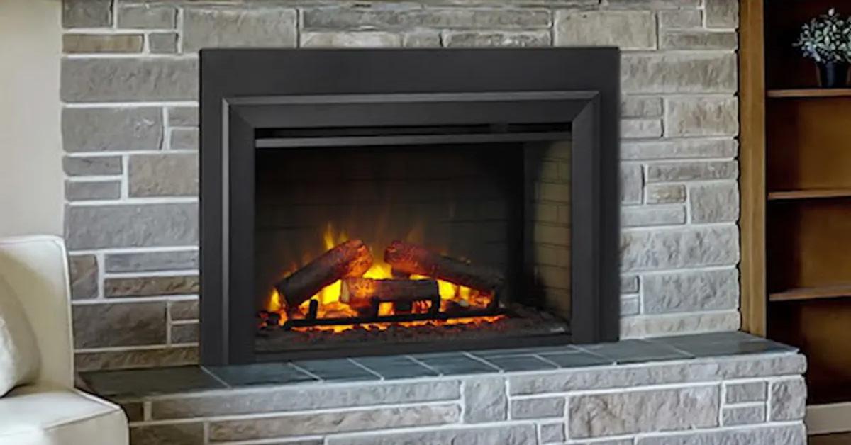 fireplace insert in a stone surround with flames