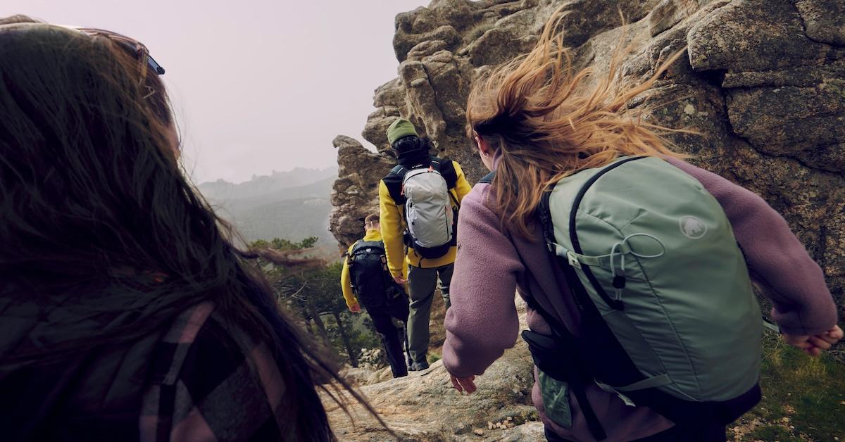 Hikers on a mountain wearing Mammut backpacks