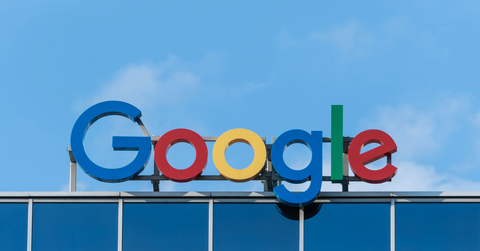 The Google sign stands on top of the building