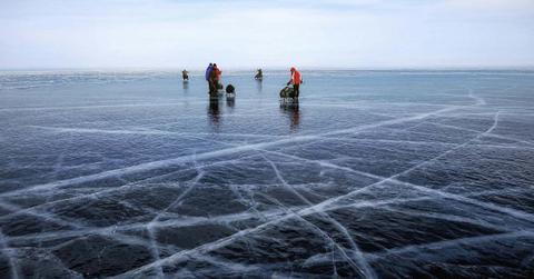 People using sleds on the cracked icy waters in Greenland. (Representative Cover Image Source: Pexels | Simon Berger)
