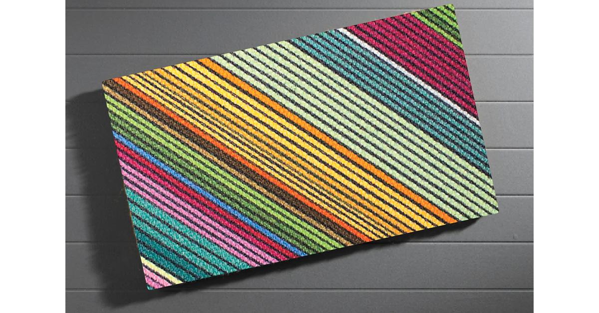 rainbow striped coir doormat on grey wood floor boards