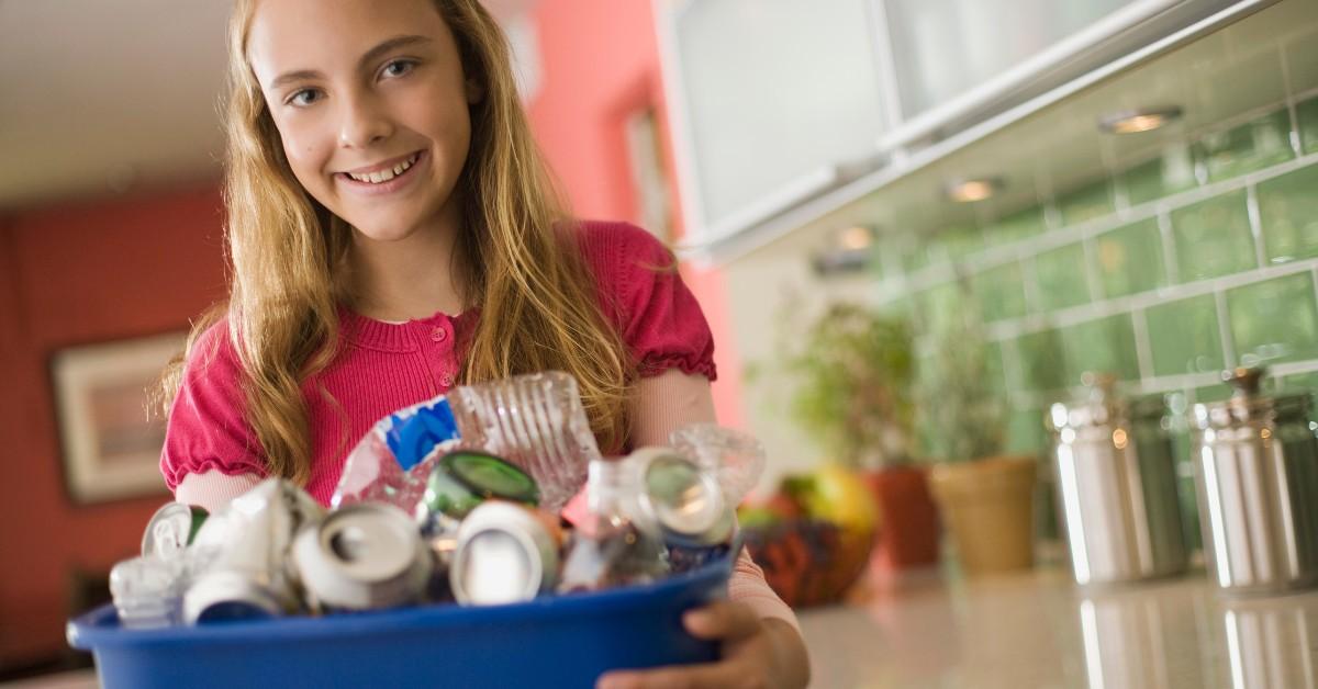 Teen girl collecting recycling 